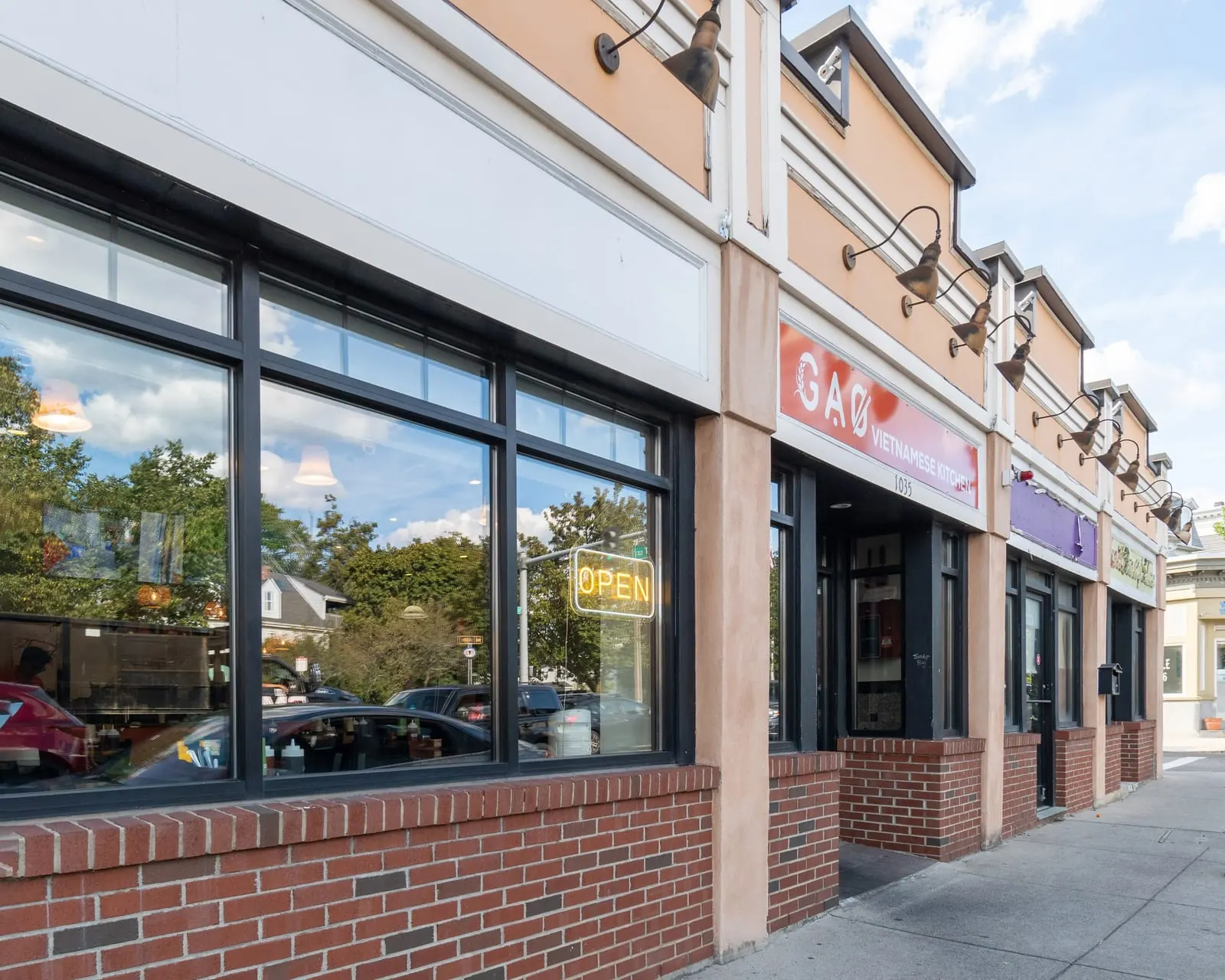 Gạo Vietnamese Kitchen storefront at 1035 Dorchester Ave with a neon OPEN sign in the window